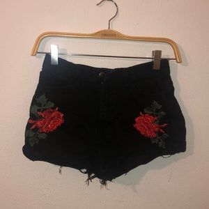 Black distressed shorts with flowers